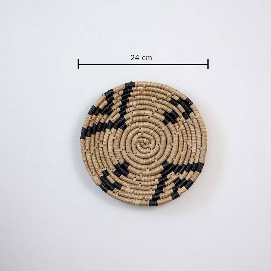 Handwoven seagrass round wall basket decor in natural beige and black with abstract spiral pattern and size guide.