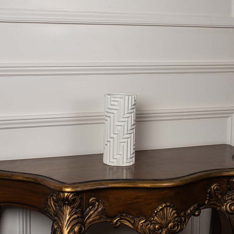 A white geometric pattern vase presented on a clean white background highlighting its tall elegant shape and modern carved texture.