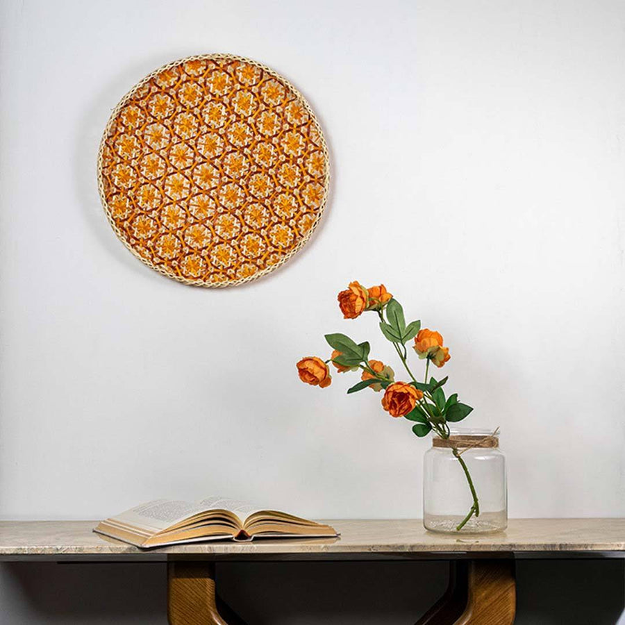Handcrafted orange and natural seagrass wall basket for living room shelf and modern boho home décor styling.