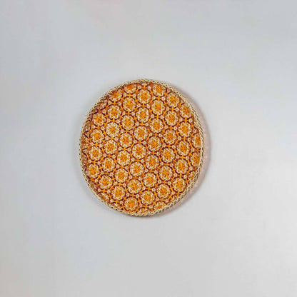 Natural woven orange and beige seagrass wall basket for living room boho décor on white background image.