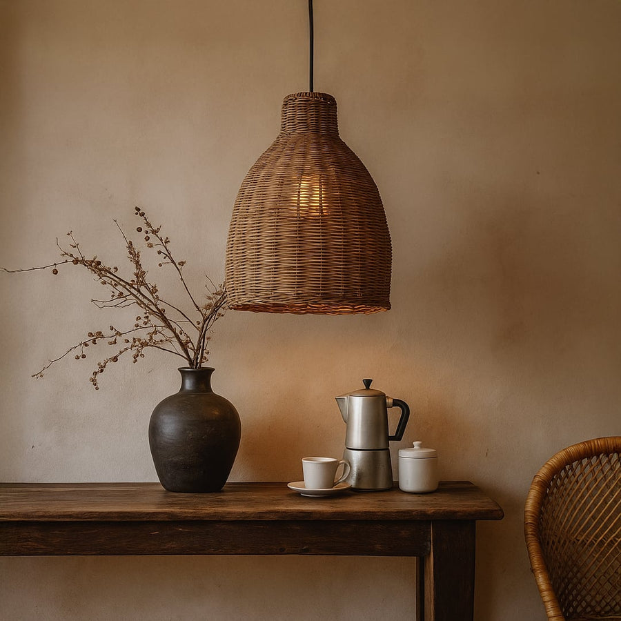 Boho tiered woven cane pendant light hanging in a cozy living room with cream sofa macrame wall art and a round wooden coffee table in daytime.