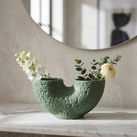 Green ceramic dual flower vase with textured finish styled with fresh blooms for elegant modern home decor.