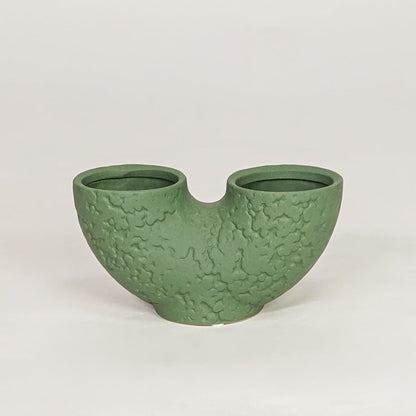 bandsaw textured ceramic vase green white background