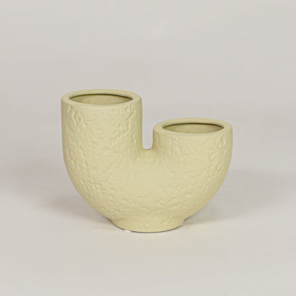 bandsaw textured ceramic vase light green white background
