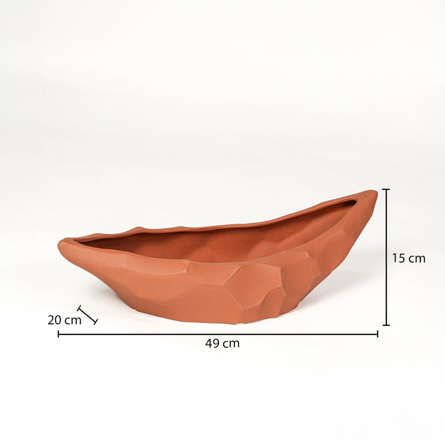 Orange ceramic decorative platter measuring 49 cm length 28 cm width and 15 cm height ideal for dining table display.