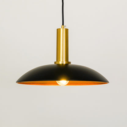 White background image of barn style black gold metal lamp for elegant dining room decor styling with bright illumination.