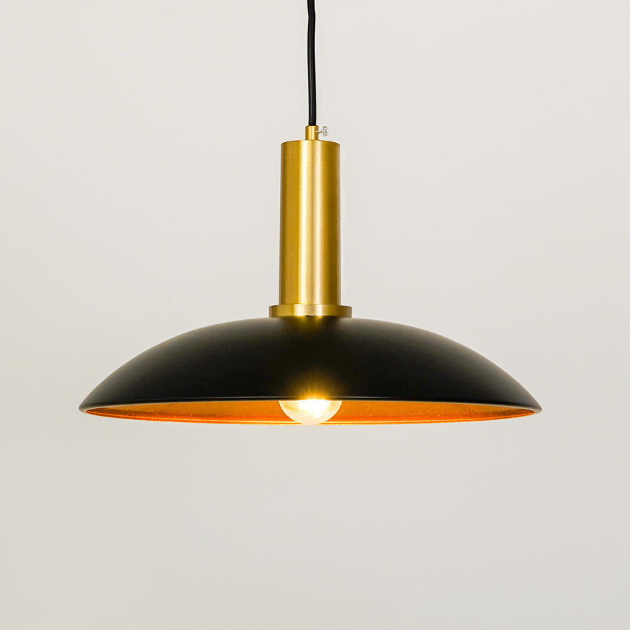 White background image of barn style black gold metal lamp for elegant dining room decor styling with bright illumination.