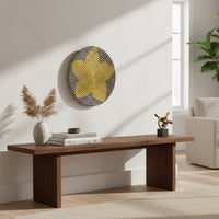 Round woven wall basket styled above a wooden console table adding natural texture warmth and handcrafted character to modern interiors.