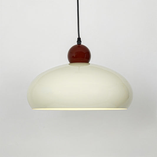 Modern cream and burgundy pendant light suspended on white background for luxury dining room decor styling.