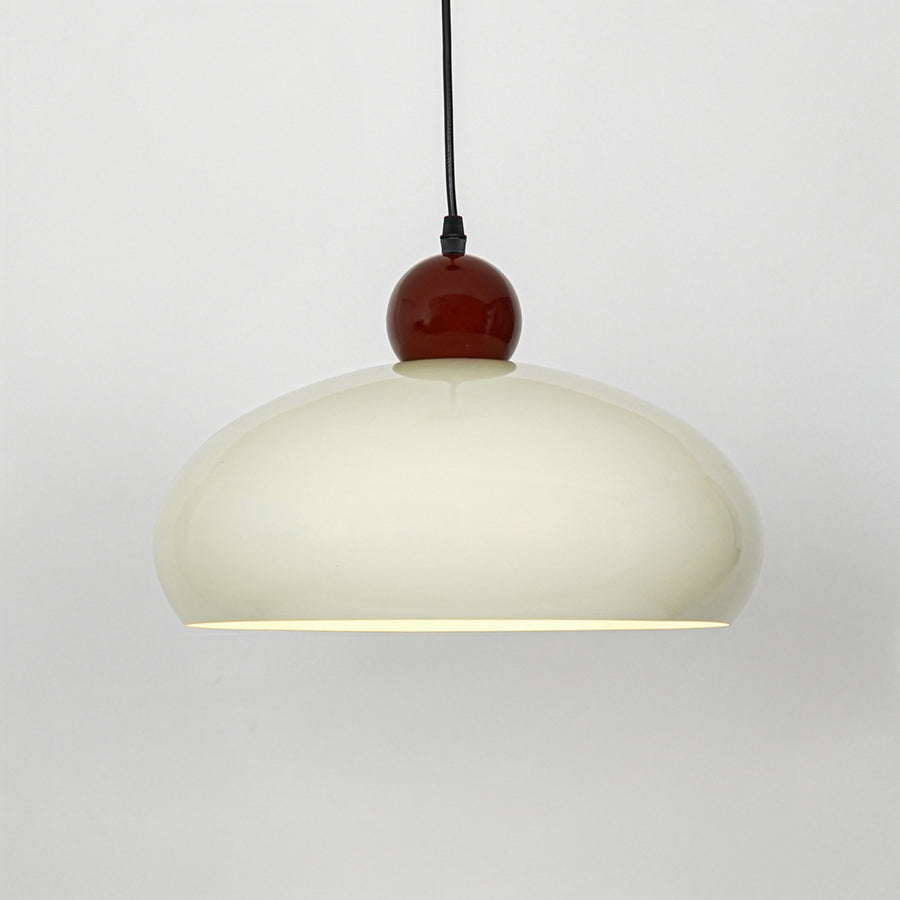 Modern cream and burgundy pendant light suspended on white background for luxury dining room decor styling.