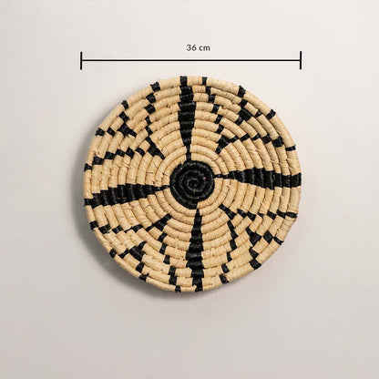 Dimension image of handcrafted black cream seagrass wall basket with geometric starburst pattern for boho wall decor display.