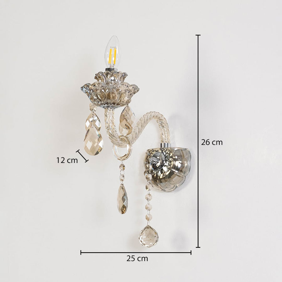 Crystal wall light with glass shade and hanging crystals size 25cm height 26cm width 12cm depth displayed with measurements.