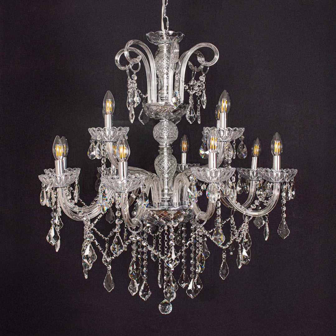 Large clear crystal chandelier shown on black background highlighting premium crystal detailing for elegant ceilings.