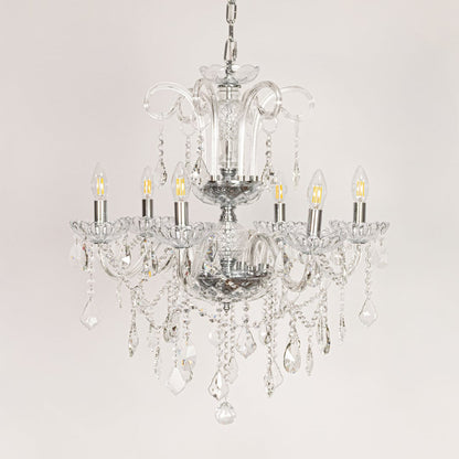 Clear crystal chandelier displayed on white background ideal for classic bright interior ceiling styling.