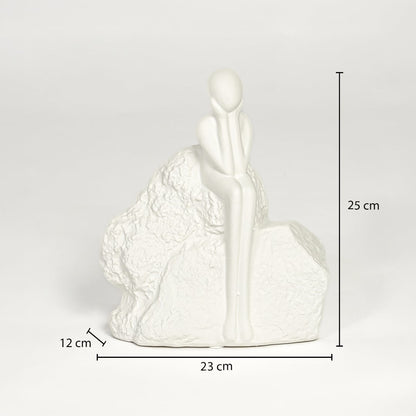 White ceramic sitting figurine sculpture 25 cm height 23 cm width ideal for console table and shelf decor.