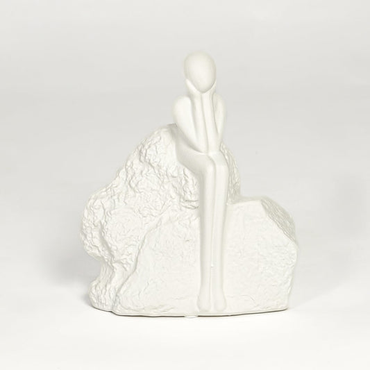 Contemporary white ceramic decorative sculpture with seated figure design for modern home decor styling.
