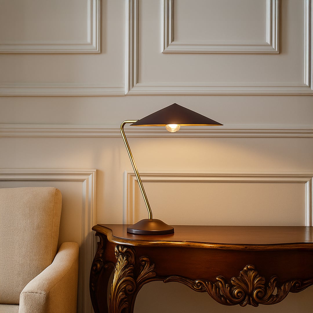 Gold metal table lamp with dark brown shade adding modern elegance to tabletop decor in a stylish living room setting.