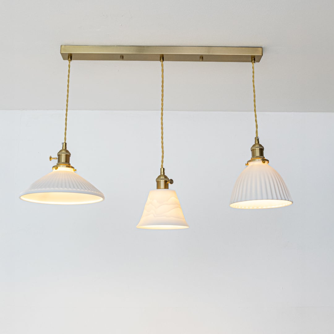 White metal pendant lights with gold accents showcasing stylish designs for contemporary home decor.