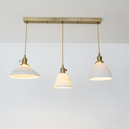 White metal pendant lights with gold accents showcasing stylish designs for contemporary home decor.