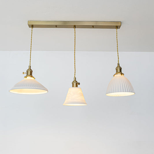 White metal pendant lights with gold accents showcasing stylish designs for contemporary home decor.