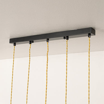 Black metal linear ceiling canopy with decorative chains showcasing premium finish and craftsmanship.