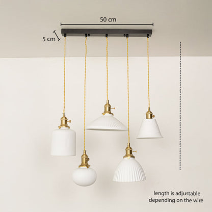 Five assorted white glass pendant lights dimension image with adjustable length and 50 cm canopy for elegant dining placement.