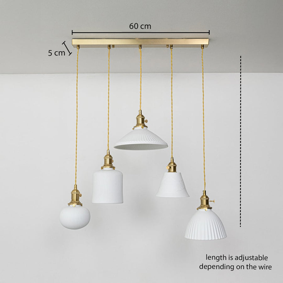 Five assorted white glass pendant lights dimension image with adjustable length and 60 cm canopy for elegant dining placement.