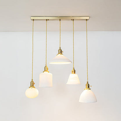 White glass and gold metal pendant lights designed for sophisticated contemporary home decor spaces.