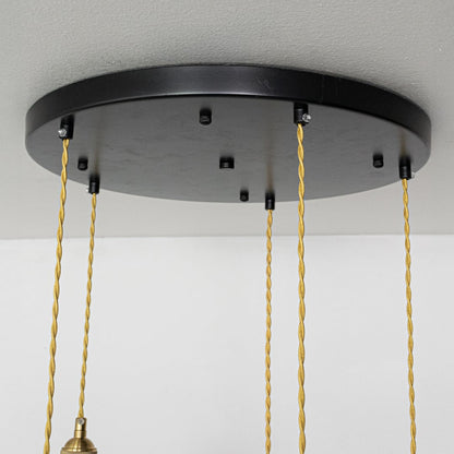 Black metal round ceiling canopy with decorative chains highlighting premium finish and craftsmanship.