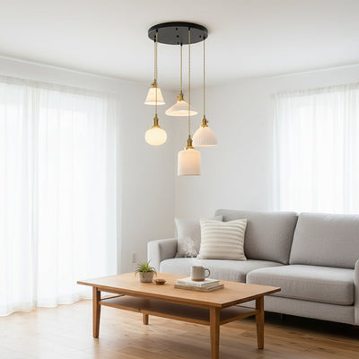 White glass and gold metal pendant lights adding elegant warmth to contemporary living room interiors.
