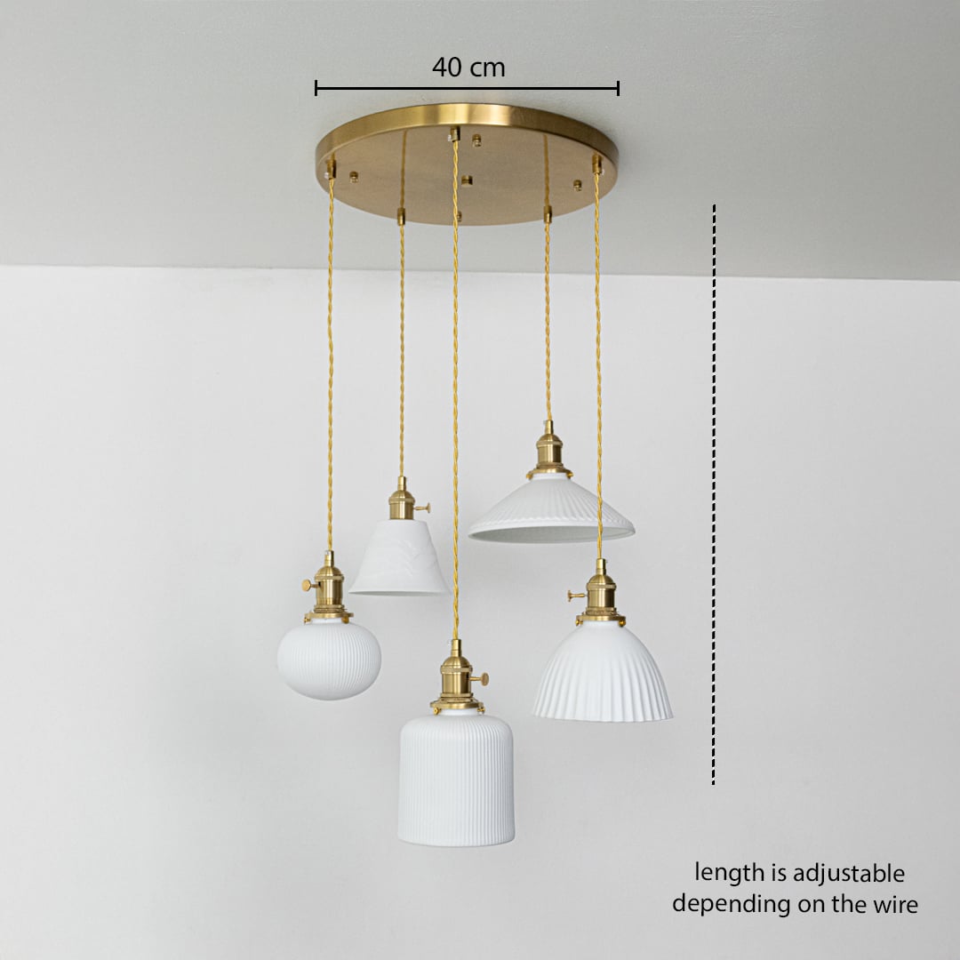 Five assorted white glass pendant lights dimension image with adjustable length and 40 cm canopy for luxury dining placement.