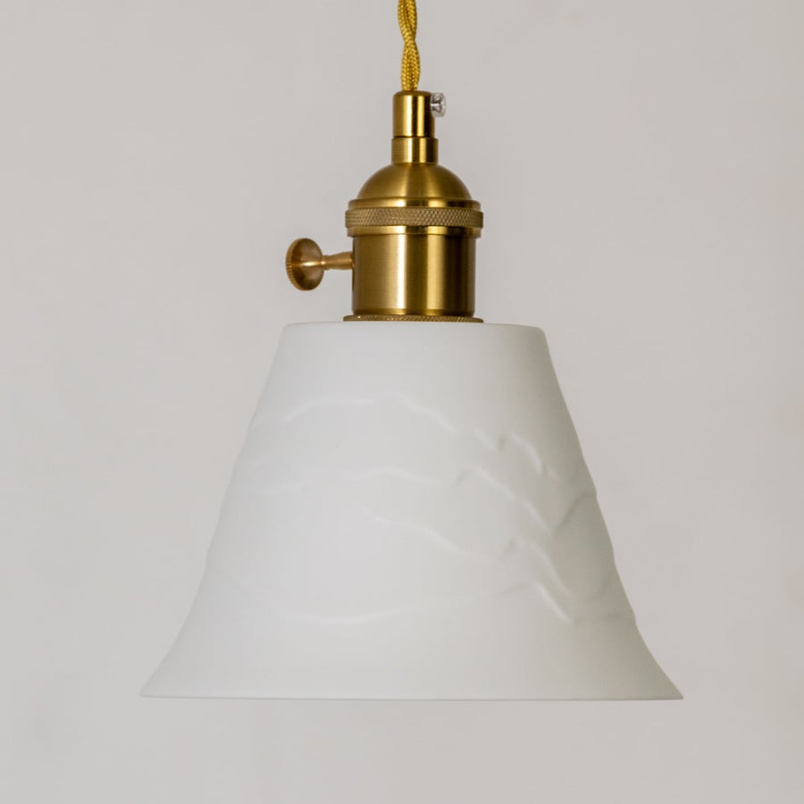 White fabric pendant light with gold metal fittings and soft glow for ceiling decor.