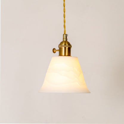 Classic pendant light in gold metal finish with white fabric shade for kitchen or dining decor lighting white background.