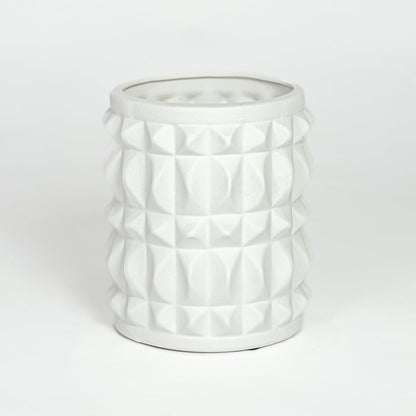 White ceramic geometric planter with raised textured pattern isolated on clean white background for modern decor styling.