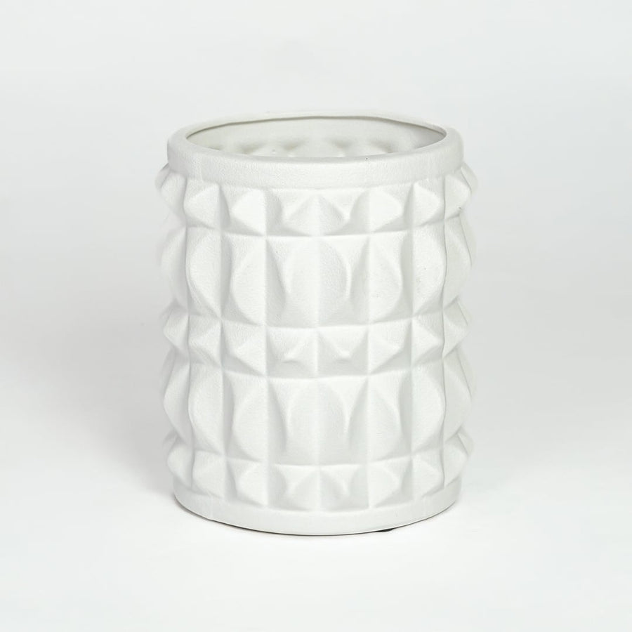 White ceramic geometric planter with raised textured pattern isolated on clean white background for modern decor styling.