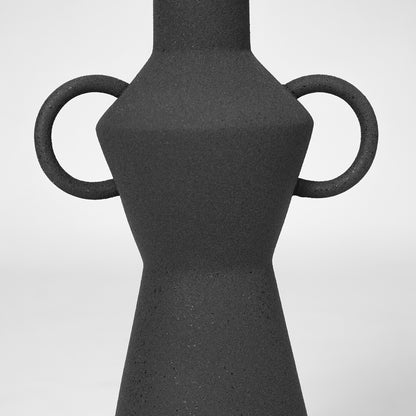 Closeup image of black ceramic handle vase for modern tabletop decor styling with elegant matte textured finish.