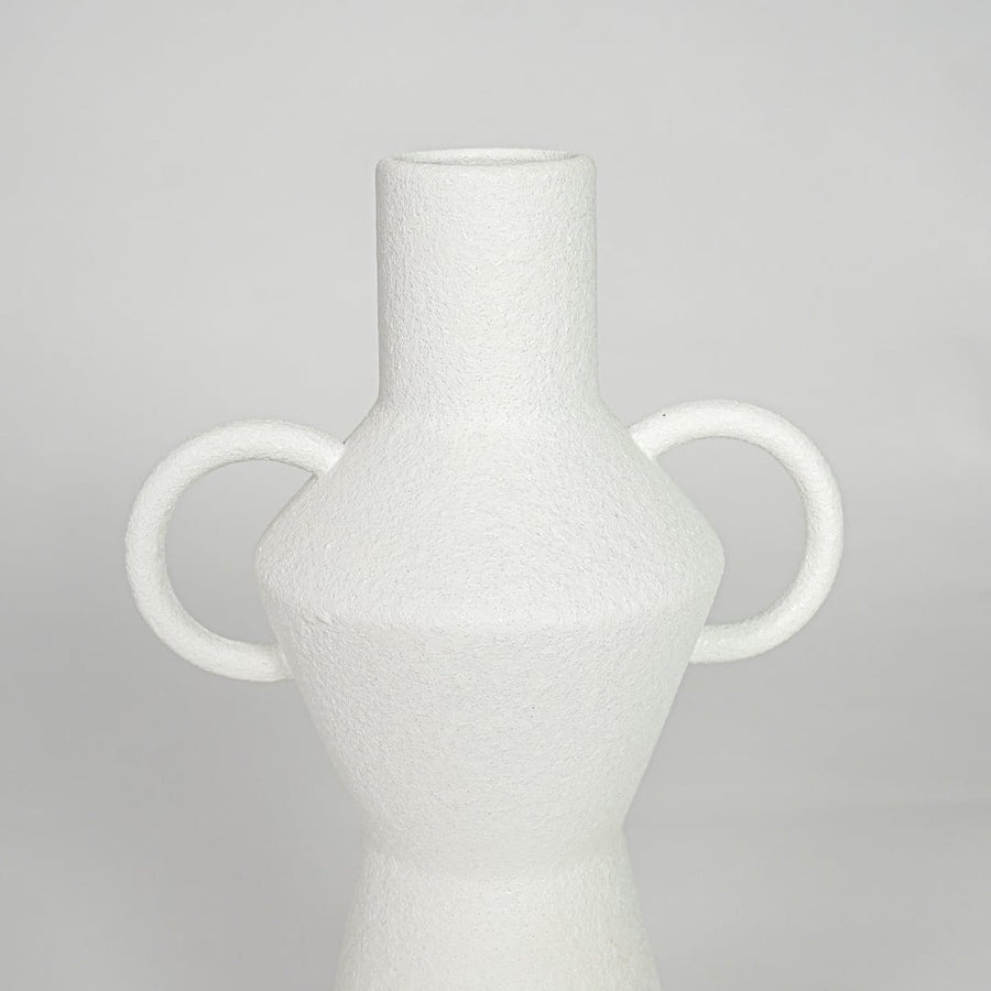 Closeup white ceramic textured decorative vase detail modern tall flower vase for table shelf console decor.