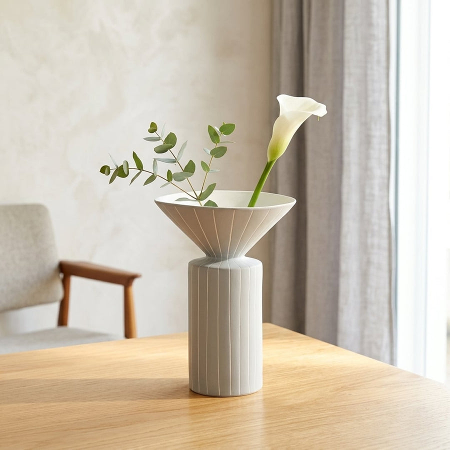 White ceramic flower vase placed on wooden table modern decorative vase for living room console home decor styling.