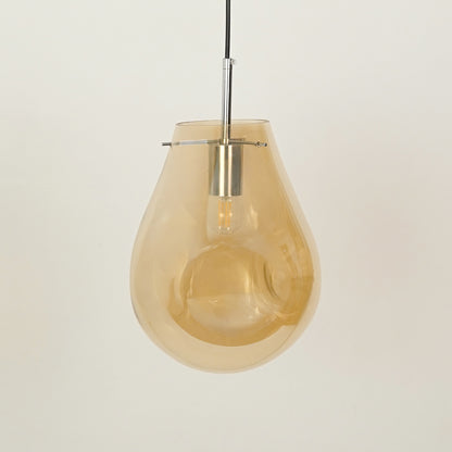 Amber glass pendant light with chrome metal fitting for elegant modern ceiling placement.