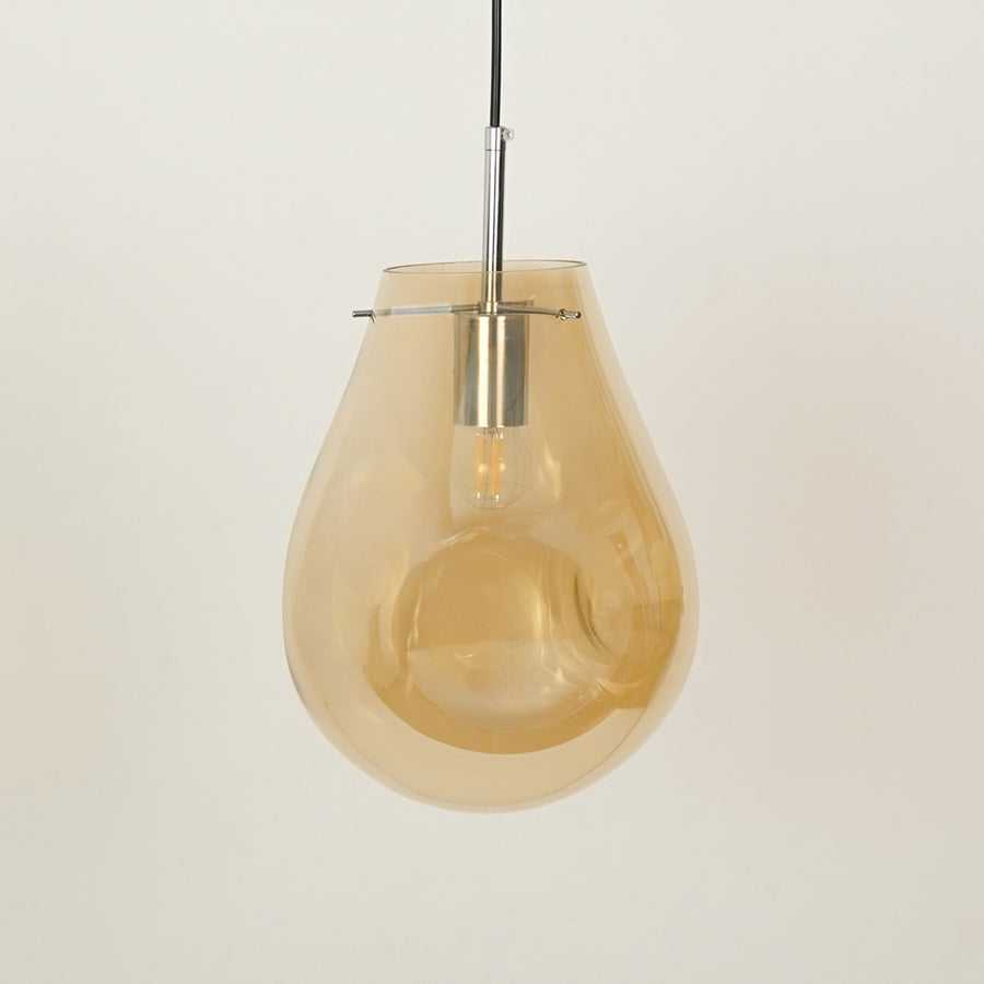 Amber glass pendant light with chrome metal fitting for elegant modern ceiling placement.
