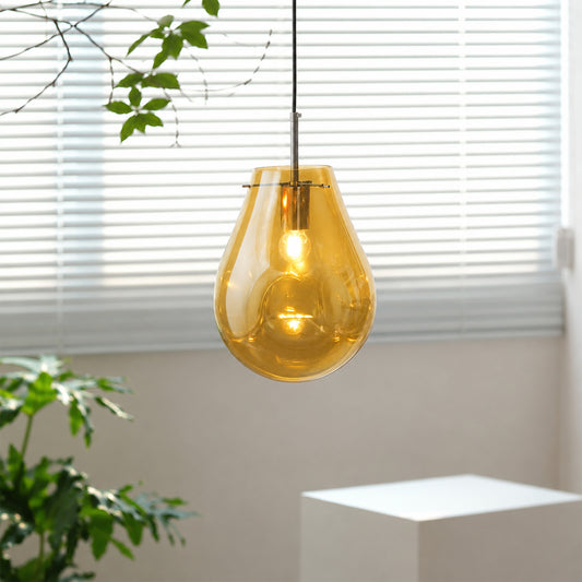 Amber glass pendant light enhancing modern interiors with warm glow and elegant contemporary ceiling appeal.