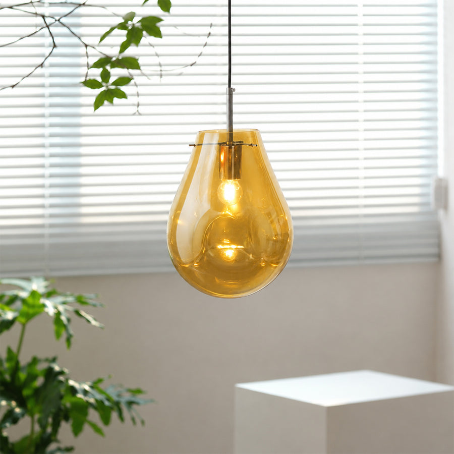 Amber glass pendant light enhancing modern interiors with warm glow and elegant contemporary ceiling appeal.