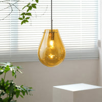Amber glass pendant light enhancing modern interiors with warm glow and elegant contemporary ceiling appeal.