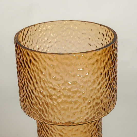 Close up view amber decorative glass vase showing rich color texture luxury glass accent piece for console shelf styling home.