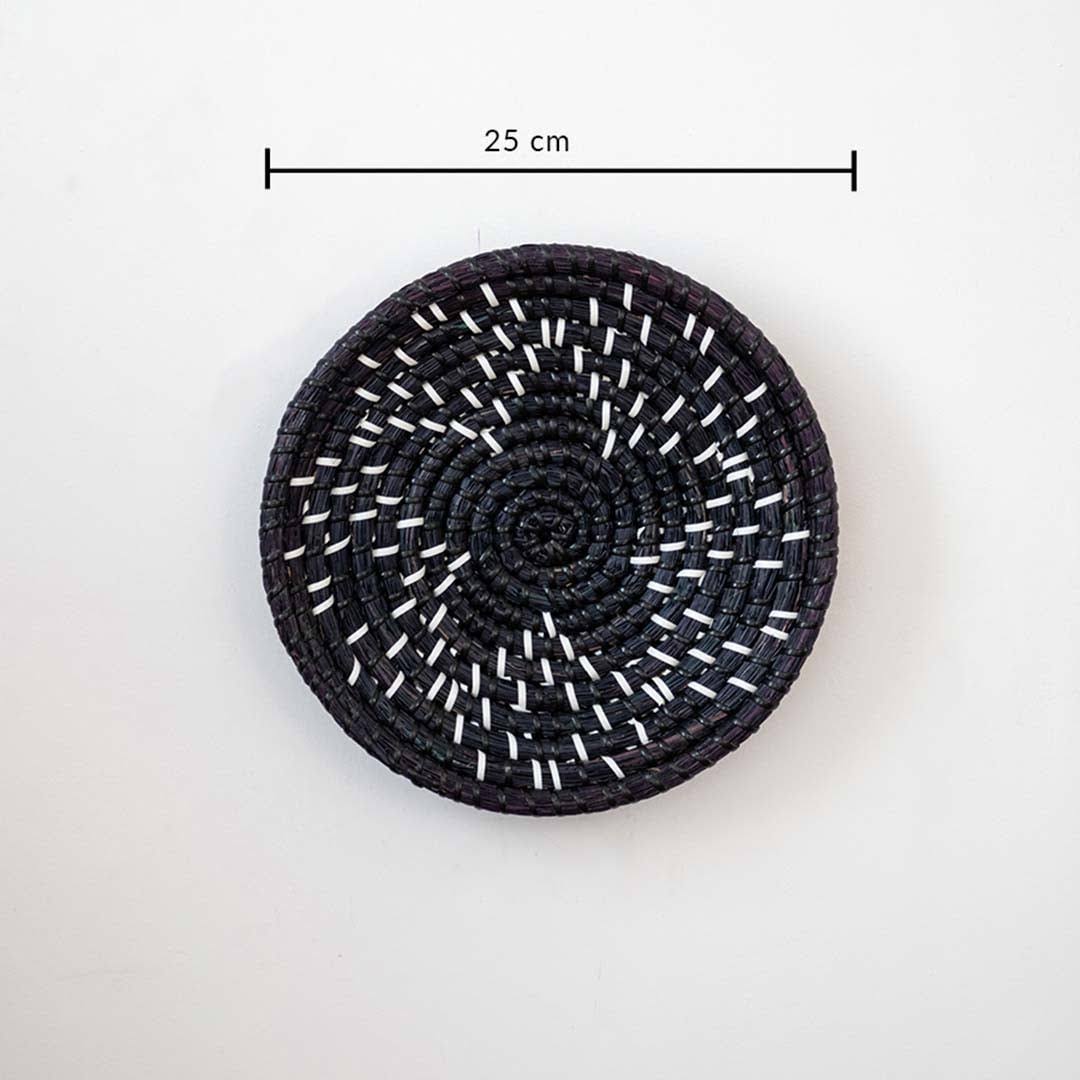 Beautiful star geometric patterned black and beige woven seagrass wall basket plate featuring a size line indicator.