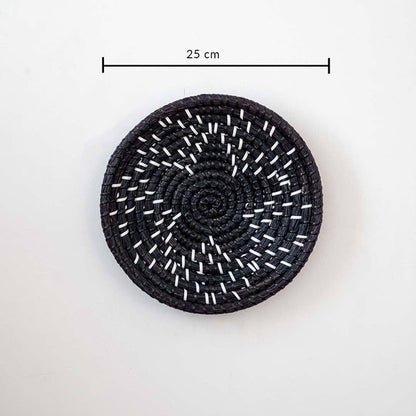 Beautiful star geometric patterned black and beige woven seagrass wall basket plate featuring a size line indicator.