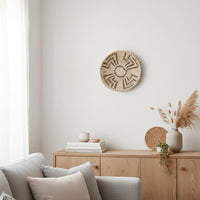 Natural woven wall basket displayed above a sofa for elegant bohemian wall decor and contemporary home interiors.