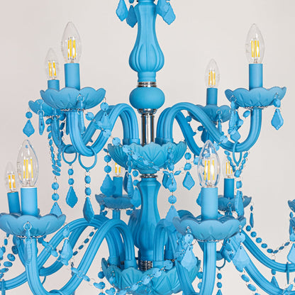 Closeup of large blue crystal chandelier with detailed beads and curved arms perfect for bold luxury ceiling decor.