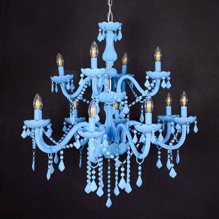 Large blue crystal chandelier shown on black background highlighting vibrant detailing for elegant interior ceilings.