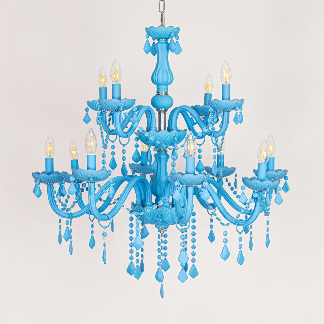 Large blue crystal chandelier displayed on white background ideal for colorful modern interior ceiling styling.